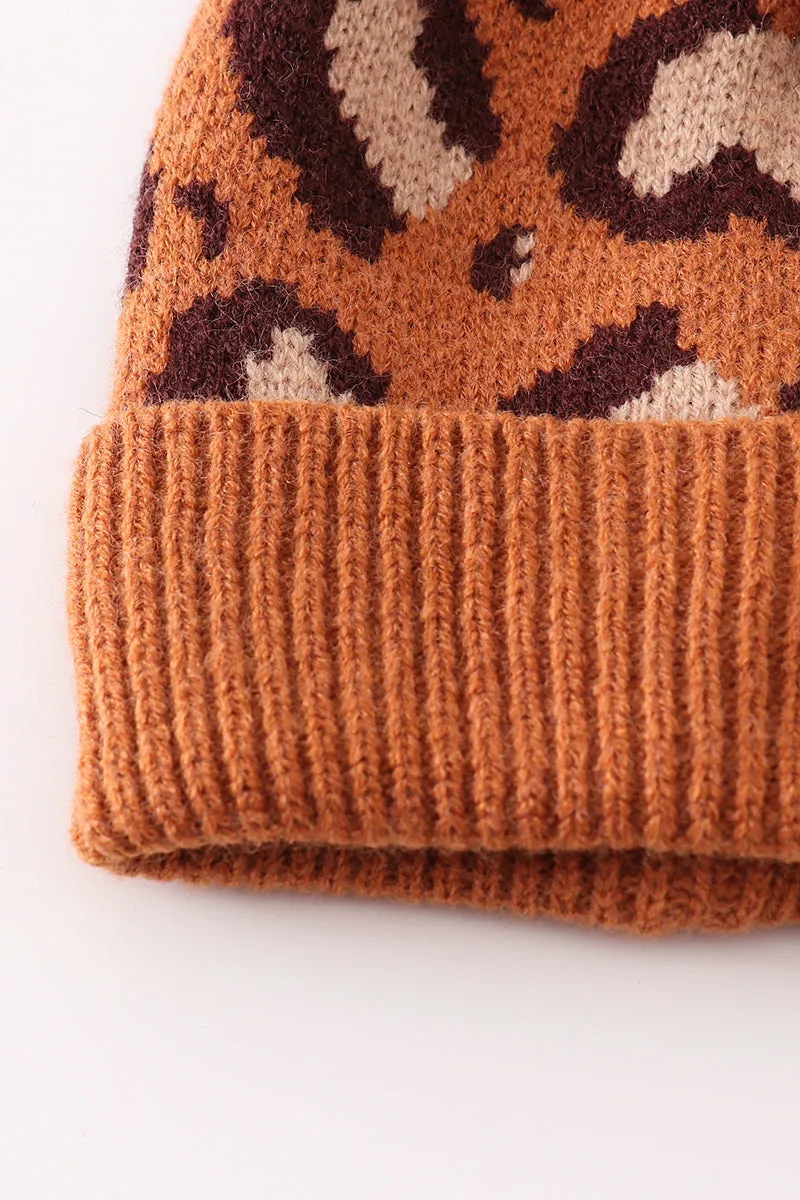 Brown pompom leopard cable beanie