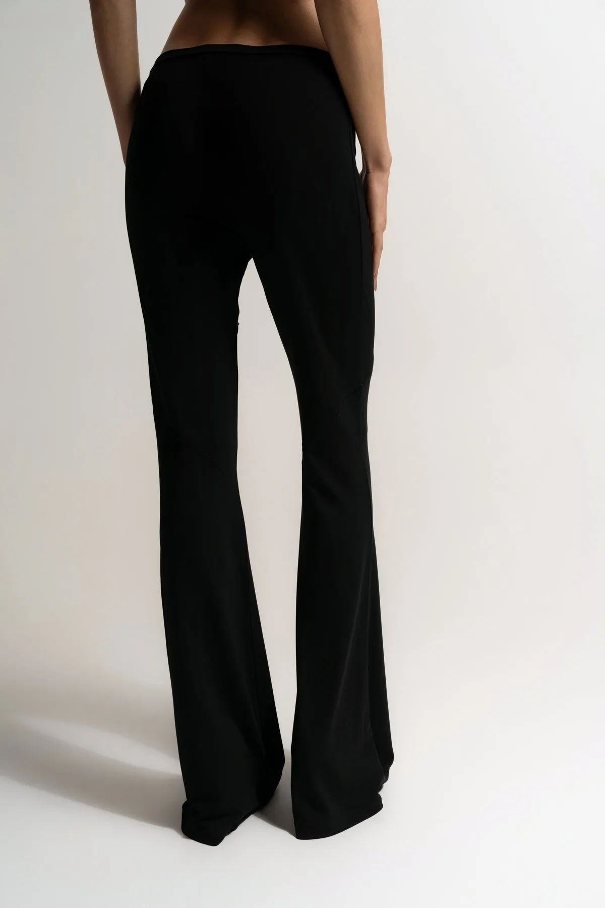 COURRÈGES | ELLIPSE ZIPPED CREPE JERSEY BOOTCUT PANTS