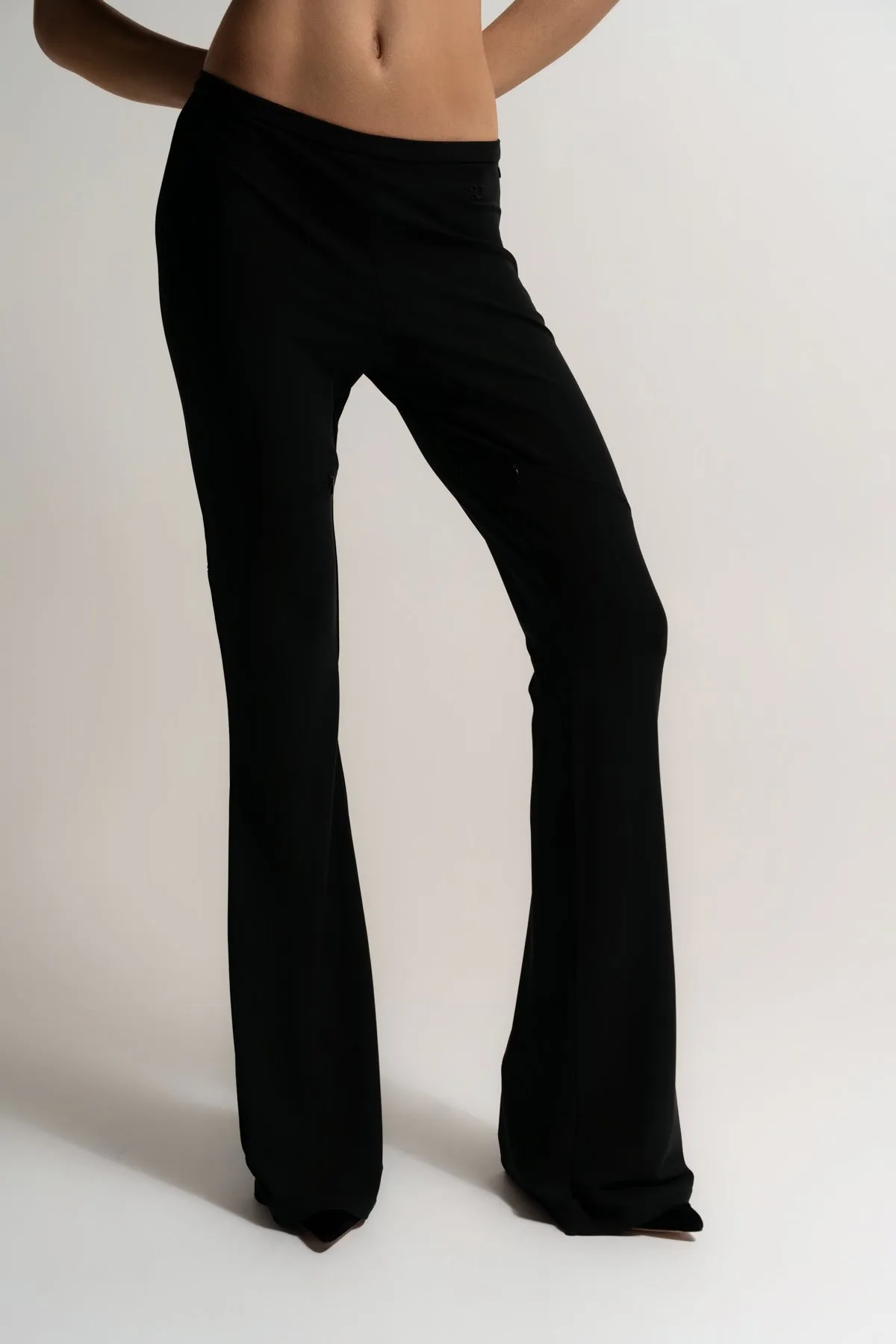 COURRÈGES | ELLIPSE ZIPPED CREPE JERSEY BOOTCUT PANTS